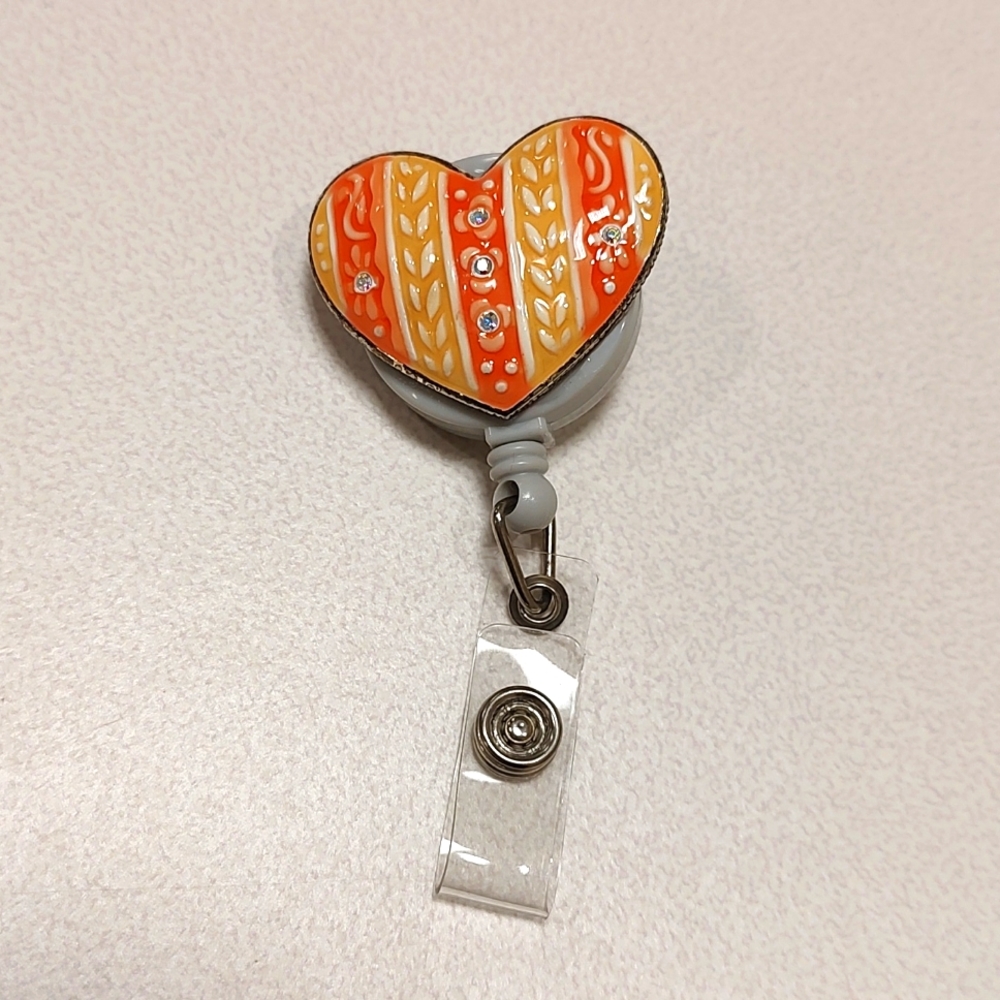 Retractable heart badge reel